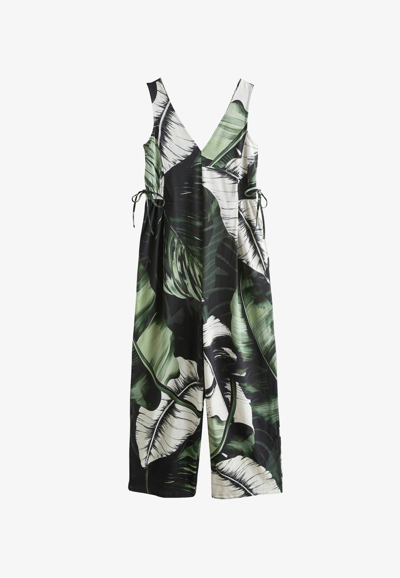 Lengvas audinys medžiaginis kombinezonas su žalių ir baltų tropinių lapų raštu, gilios V formos iškirpte ir reguliuojamais raišteliais liemens srityje.