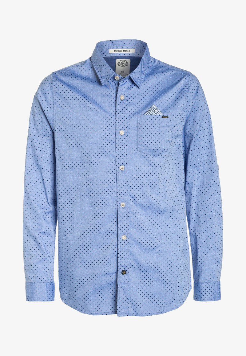 Camisa de manga larga azul con un pequeño patrón de lunares, cierre de botones en la parte delantera y un bolsillo en el pecho con un sutil acento gráfico.