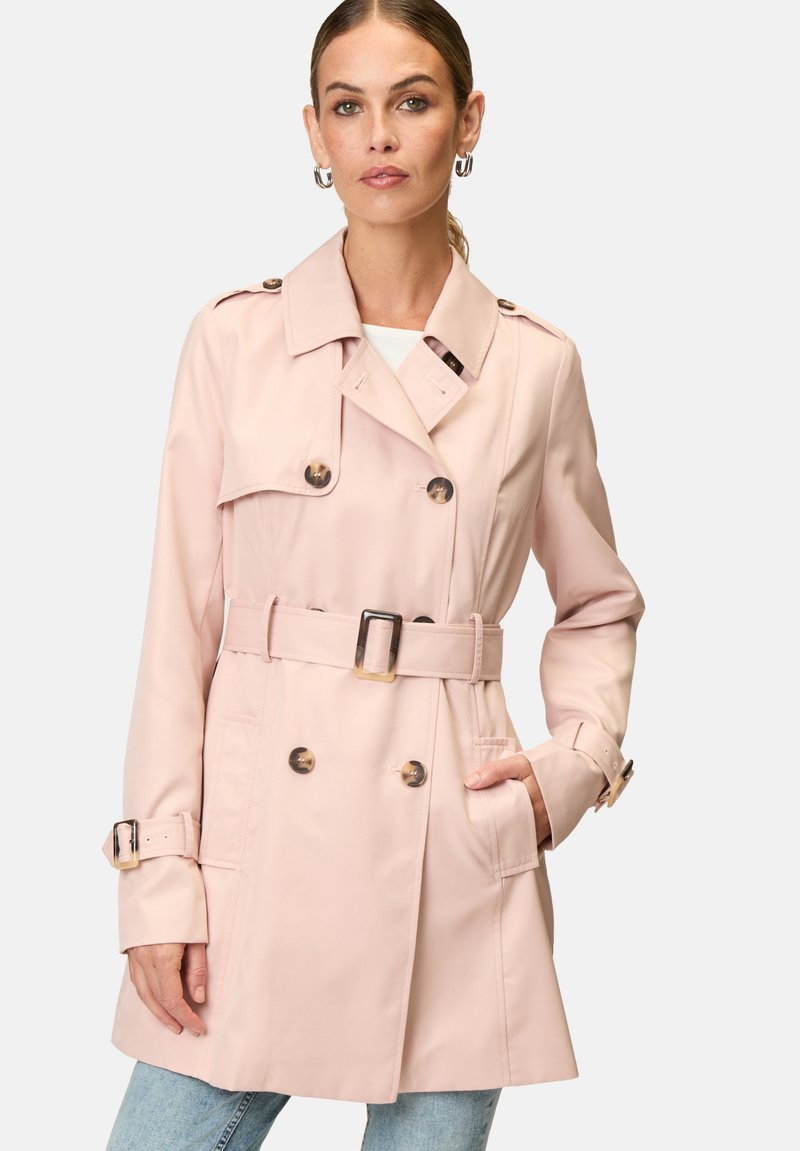 Light pink trench coat with double-breasted buttons, a belted waist, and shoulder epaulettes, made from smooth fabric, featuring side pockets.