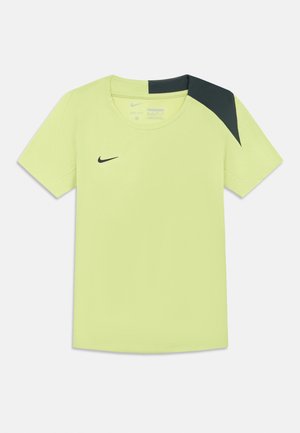 Nike T-paita kirkkaankeltaisena, lyhyillä hihoilla, pyöreällä kaula-aukolla ja mustalla yksityiskohdalla olkapäällä. Valmistettu hengittävästä kankaasta, jossa on logo.