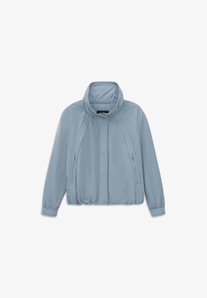 Light blue long-sleeve jacket with stand-up collar, front zipper hidden by flap, elastic waistband, and zippered side pockets.