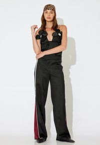 Koton X İNJI - WIDE LEG - Trainingsbroek - black