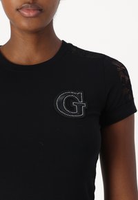 Guess T-shirt con stampa - jet black