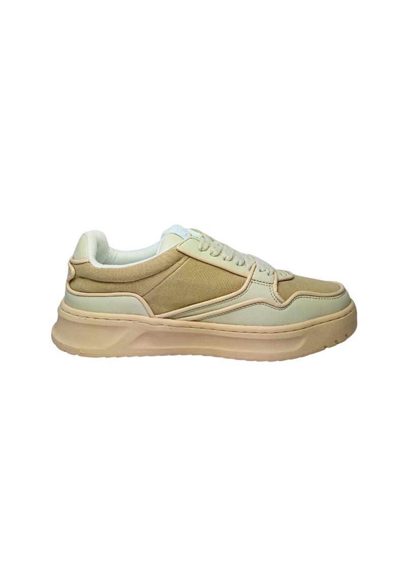 Beige sneakers with a textured fabric panel, smooth leather accents, and a thick rubber sole. Features lace-up design and padded collar.