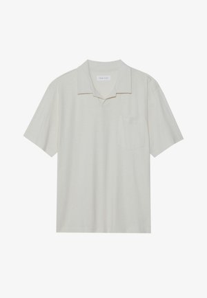 Lühikese varrukaga polo särk heledast beežist materjalist, kraega kaelus, ühekohaline rinnatasku ja lõdva istuvusega. Sile tekstuur ja minimaalne disain.