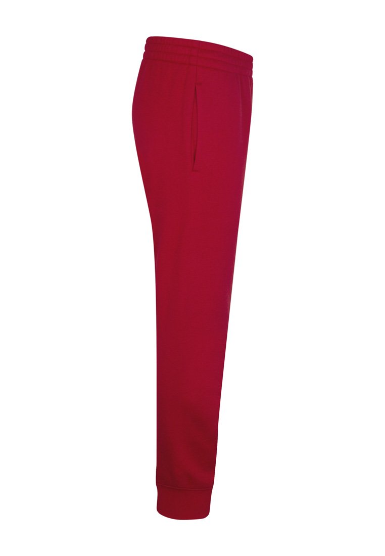 Pantalones jogger de algodón rojo con cintura elástica, bolsillos laterales y puños acanalados. Textura suave con una silueta ajustada.