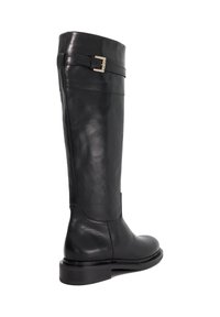 Black leather knee-high boots with a smooth texture, flat sole, and a gold buckle accent on the upper. Minimalist design with sleek lines.