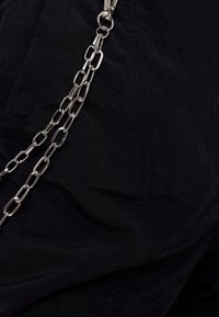 Bershka Tygbyxor - black