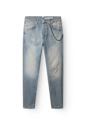 Light blue denim jeans with a faded finish, featuring a chain accent on the right side and a slim fit design.