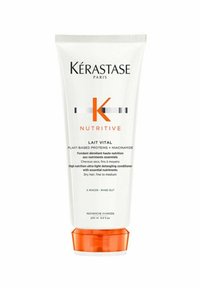 Kérastase Nutritive Lait Vital conditioner in a white tube with orange base; includes plant-based proteins and niacinamide for hydration.
