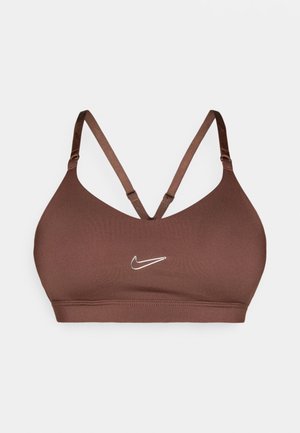 Brūns sporta krūšturis ar plānām regulējamām lencēm, kas krusteniski savērptas muguras daļā, un baltu Nike logotipu priekšpusē centrā.