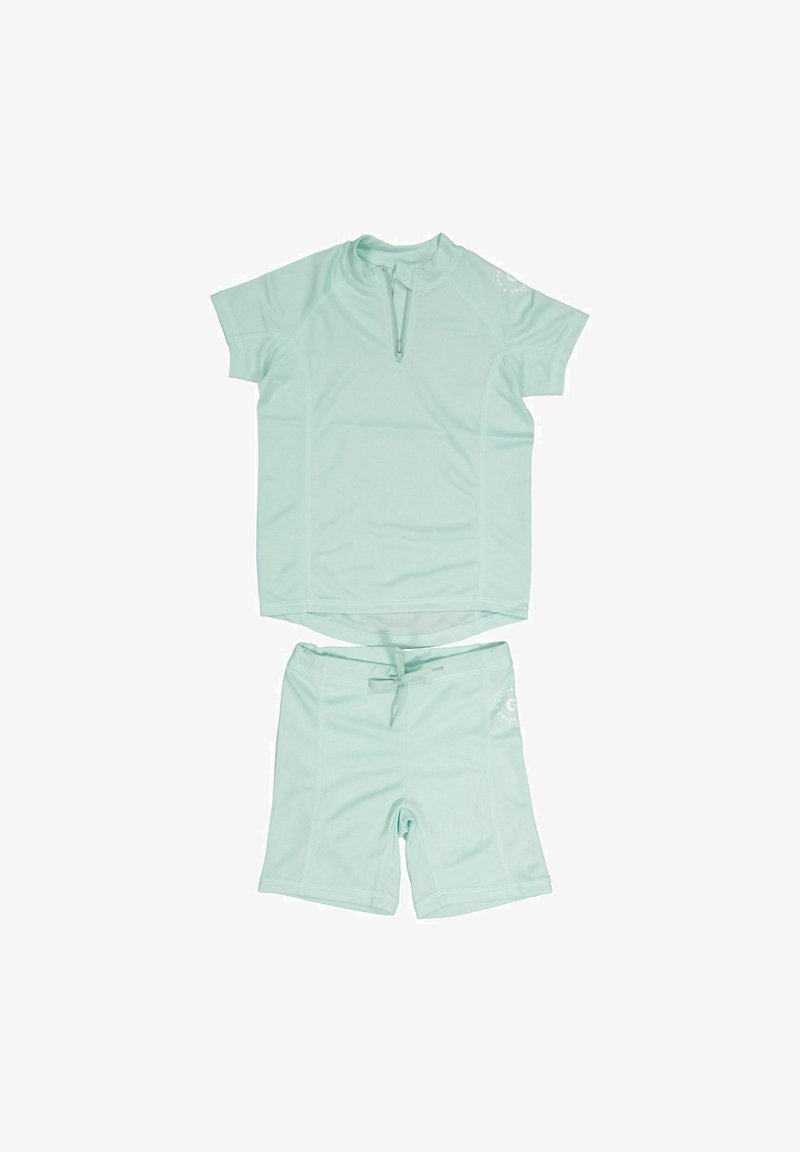 Vaalean mintunvihreä lyhythihainen rash guard, jossa on vetoketju kauluksessa ja yhdistehousut. Pehmeä ja joustava materiaali. Housuissa on logotieto.