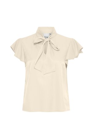 Bežs blūze ar īsām volānu piedurknēm un kakla saiti. Gluda auduma, brīvs piegriezums. Ar paslēptu pogu aizdari pie kakla.