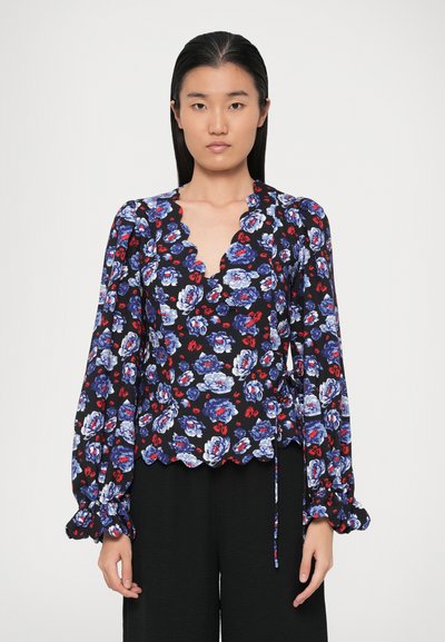 Floral blouse featuring a scalloped neckline, long puff sleeves, and a black background with blue and red flower patterns. Ties at the waist.