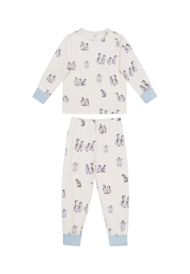To-delt pyjamasæt i blød cremefarvet stof. Blusen har lange ærmer og pingvinprint; bukserne har elastisk liv og matchende design.