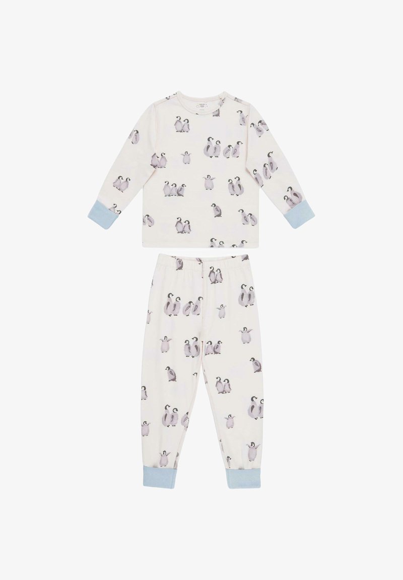 Two-piece pajama set in soft cream fabric. Top features long sleeves and penguin print; pants have elastic waistband and matching design.