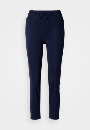 Donkerblauwe joggerbroek met een aantrekkoord in de taille, taps toelopende pijpen, voornaadjes en spleetaccenten bij de manchetten, gemaakt van zachte, flexibele stof.