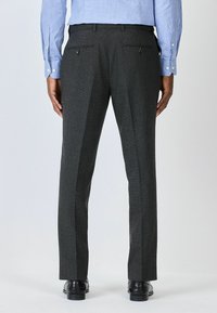 Gray tailored trousers made from textured fabric, featuring double back pockets, belt loops, and a straight-leg design.