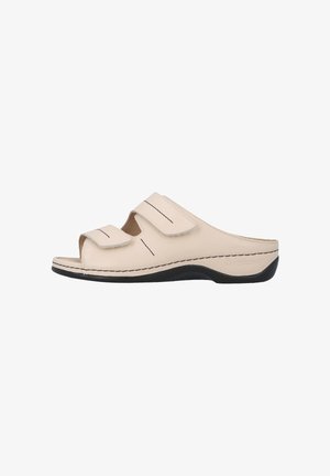 Beige open-toe slide sandaal met twee verstelbare klittenbandsluitingen en een zwarte buitenzool, ontworpen voor comfort en ondersteuning.
