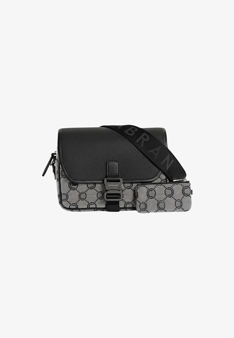 Sacoche en bandoulière noire et grise avec un extérieur texturé, présentant un motif géométrique, une sangle ajustable et une fermeture à clasp.
