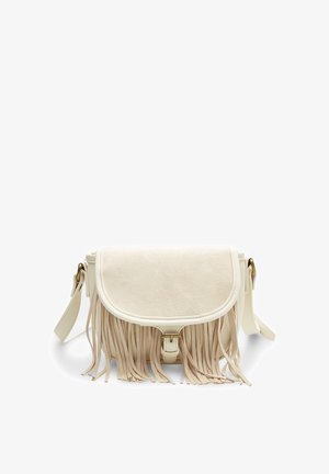 Fringe crossbody bag in creamy suede with a flap closure and gold hardware, featuring a textured surface and adjustable strap.