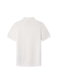 Polo shirt bianco a maniche corte in cotone. Presenta un colletto classico, una texture liscia e un design pulito e minimalista senza decorazioni.