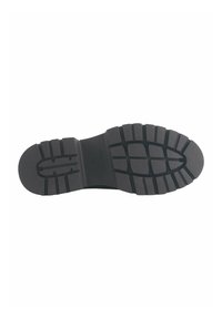 Suela de goma negra con un diseño de banda de rodadura estampada para agarre y tracción. Presenta una estructura plana y flexible sin acentos visibles.