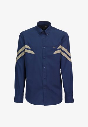 Camicia blu navy con bottoni, righe diagonali color beige chiaro sulle maniche, dettaglio con singolo logo sul petto a sinistra e colletto a punta. Vestibilità standard.