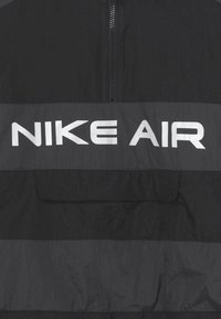 Nike Sportswear AIR UNLINED ANORAK - Allvädersjacka - black/dark smoke grey