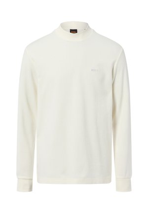 Crème-kleurige blouse met lange mouwen, gemaakt van zachte stof, met een hoge kraag en een klein geborduurd logo op de borst.