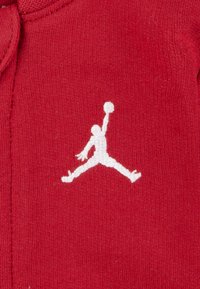 Jordan JUMPMAN COVERALL UNISEX - Jumpsuit - gym red