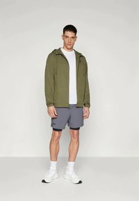 Under Armour RIVAL WOVEN - Giacca a vento - marine green