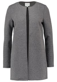 Cappotto grigio strutturato con scollo rotondo, maniche lunghe e chiusura frontale. Presenta un pannello nero a contrasto lungo la parte anteriore.