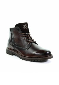 Stivaletti in pelle marrone con una texture liscia, punta tonda, sistema di allacciatura e un colletto in suede scuro a contrasto. Suola in gomma robusta.