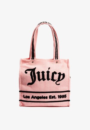 Pink woven tote bag with black lettering. Features "Juicy" and "Los Angeles Est. 1995" text, black stripes on the sides, and dual handles.
