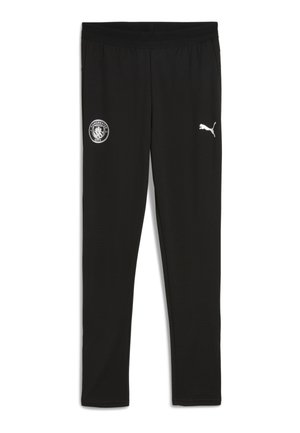 Schwarze Sporthosen mit einem Manchester City-Logo auf dem linken Oberschenkel und einem weißen Puma-Logo auf dem rechten Oberschenkel.