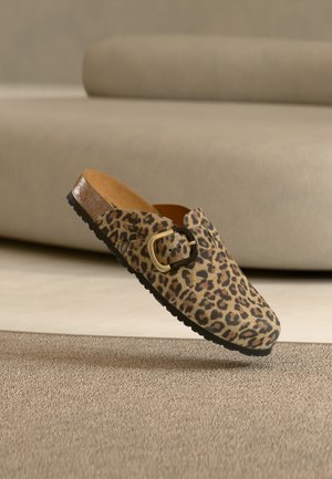 Leopard print slip-on shoe with a black buckle, brown suede upper, textured rubber sole, and cushioned insole.