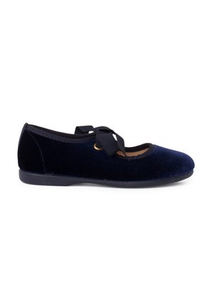 Navy velvet ballerina flat with a rounded toe, black trim, and a decorative ribbon bow on the upper. Flat rubber sole.