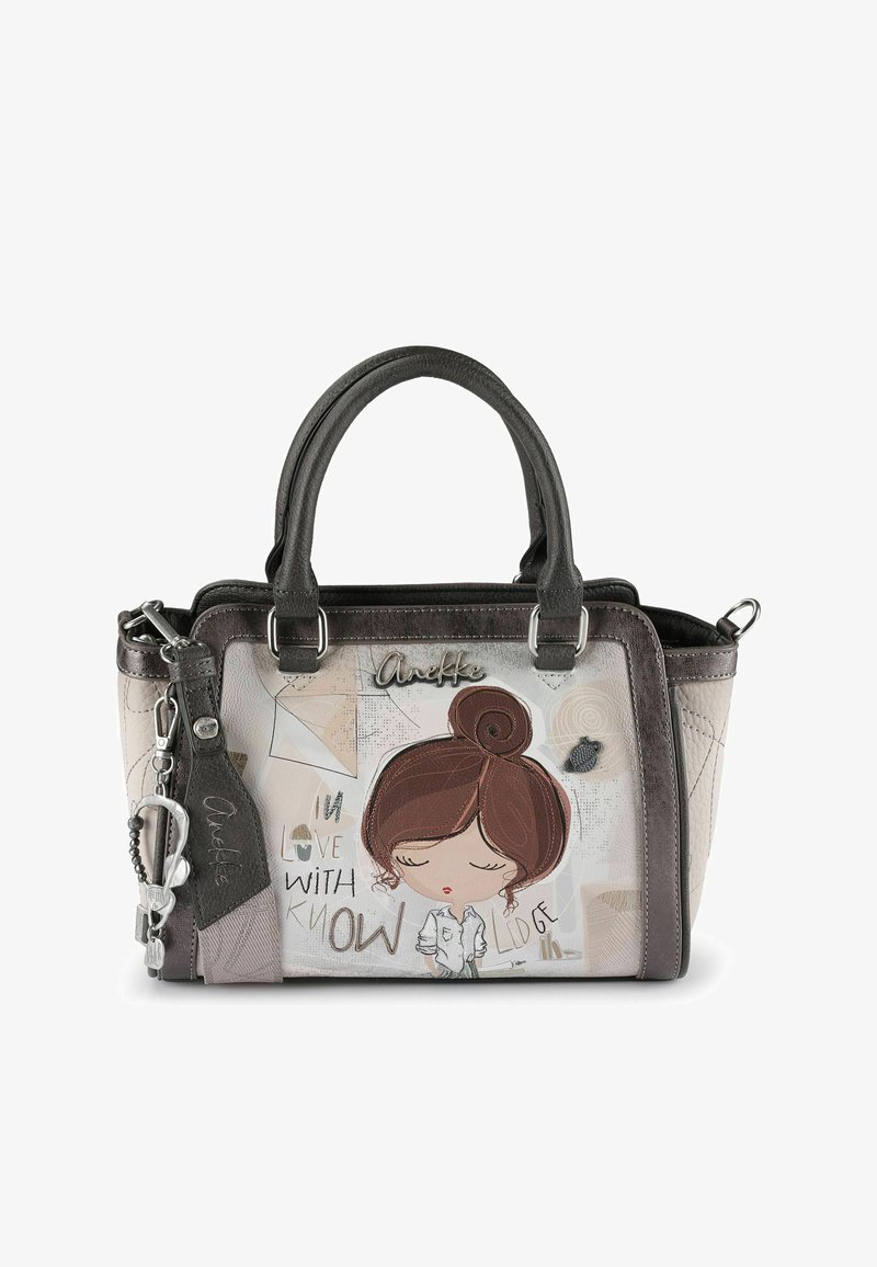 Sac à main noir et beige avec double poignées, illustration de fille aux yeux fermés, et texte "Amoureuse du savoir" en polices mixtes.