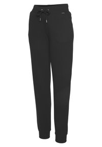 Schwarze Fleece-Jogginghosen mit einem Kordelzugbund, schmal zulaufendem Bein und elastischen Bündchen. Weiche Textur mit einem schlichten Design, geeignet für Freizeitkleidung.
