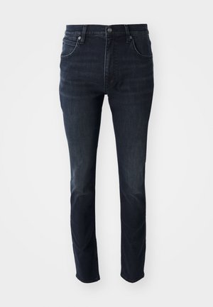 Tumedat sinised denim püksid sirge lõikega, viie tasku disainiga ja reitel kerge pleekimise efektiga, millel on metallist nööbiga sulgemine.