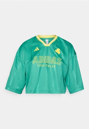 Green Adidas cropped jersey with short sleeves, featuring yellow accents, a V-neck, and prominent "ADIDAS SPORTSWEAR" text. Smooth fabric texture.