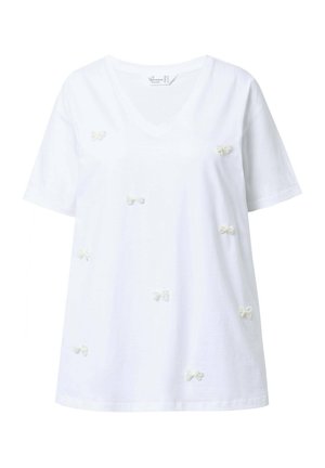 T-shirt en coton blanc avec un col en V et des manches courtes, orné de plusieurs petits nœuds brodés en blanc sur le devant.