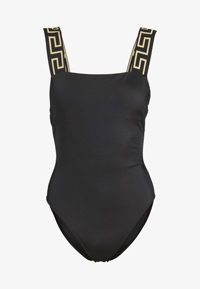 Musthave must rõngas kaelusega must ujuvpüks, laiad mustriga rihmad, millel on kuldne Kreeka võtme disain. Sile tekstuur, mõõdukas lõige.
