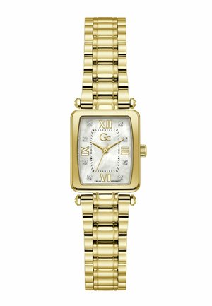 Reloj de pulsera rectangular dorado con esfera de nácar, números romanos en las posiciones 12, 3, 6 y 9, y marcadores de horas de cristal, con correa de eslabones dorados.