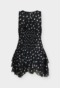 Crna haljina bez rukava s bijelim točkicama, naborani slojeviti rub, nabrani struk i zatvaranje na leđima s izrezom u obliku ključa.