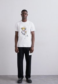 MOSCHINO T-shirt imprimé - fantasia bianco