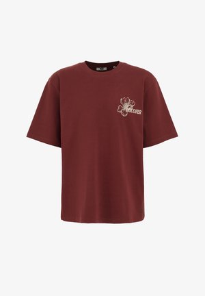 Burgundska bombažna majica s kratkimi rokavi, z rožnatim motivom in besedo "RAZISKUJ" v beli barvi na prsih. Enostaven kroj in tekstura.