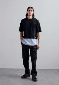 MOSCHINO T-shirt imprimé - fantasia nero