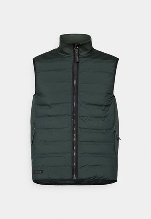 Mörkgrön vadderad väst med hög krage och hel dragkedja framtill. Har sidfickor och svarta detaljer längs kanterna.